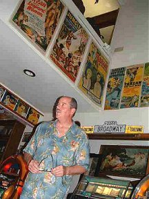 Danton amidst the Tarzan posters and memorabilia in the hodge podge room.