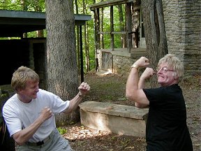 Heavyweight pugilist, JoN instructs Tarak in mastering a John L. Sullivan stance