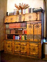 The bookcase he designed and carved for daughter Eya in Taos
