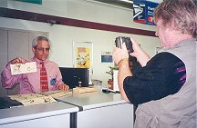 Tarzana Postmaster Displaying Commemorative ERB Envelopes and Postmarks