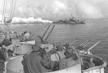 USS Cony laying a smoke screen