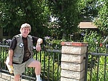 JoN on sidewalk beside wrought iron fence and ERB, Inc. front