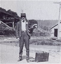 ZG with luggage and fishing gear wating for train at Lackawaxen 1900