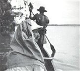 In canoe with sun helmet