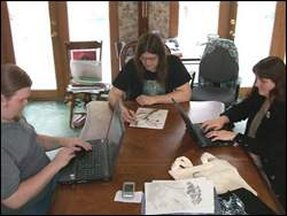 Kylen Wiggins (left), David Burton and Kathleen Wiggins in the Leanta Books office