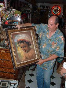 Danton holding picture painted by his father, John Coleman Burroughs