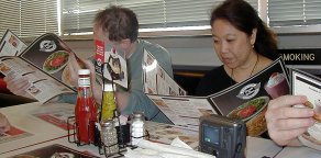 Laurence and Dejah baffled by all the exotic foreign food