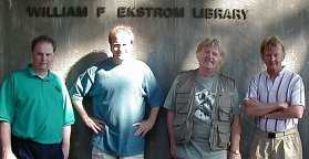 Laurence, Tracy, Bill and Bob arrive at the Ekstrom Library