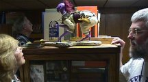 Mary and Jim admire Moon Maid figurine