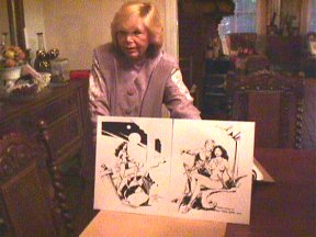 Mary displaying some of Tom Yeates' sketches