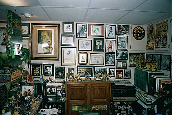 13. Autographed movie stills on the side of Mike's desk.