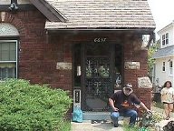 John Numa Vaughan at front door of House of Greystoke