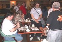 Ghak sitting down to breakfast