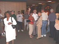 Burroughses and Bob Hyde lost in a sea of other conventioners all dressed in white