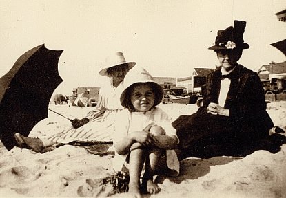 Enjoying a day on the beach with Grandma ~ age 7