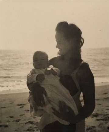 Jane and baby John on the beach